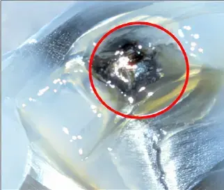 RSFG-B4-T19 post-test surface with the beginning of visible material removal circled in red